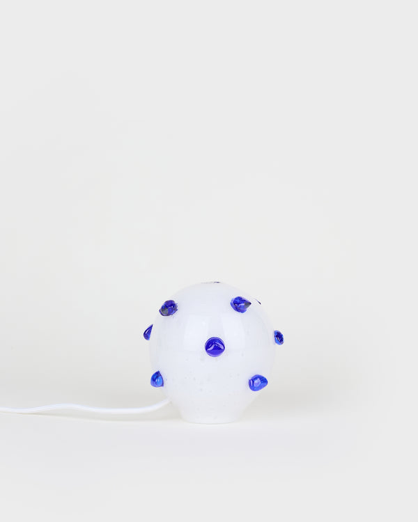 The little white and blue bedside lamp