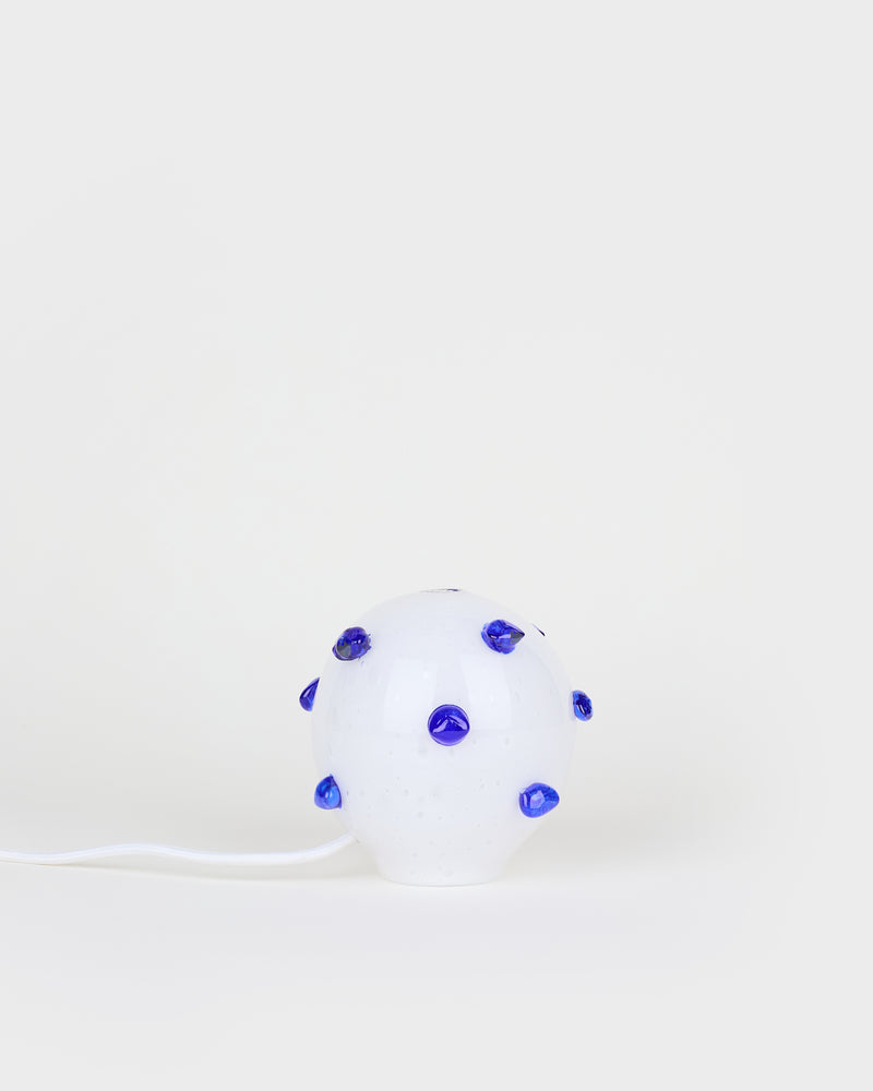 The little white and blue bedside lamp