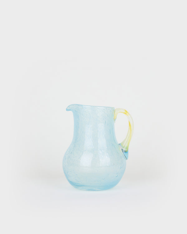 The large round sky blue and yellow bubble decanter